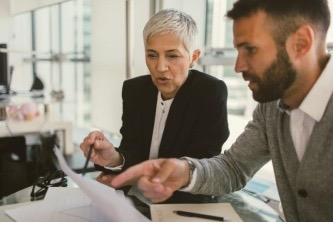 two people looking at a computer screen